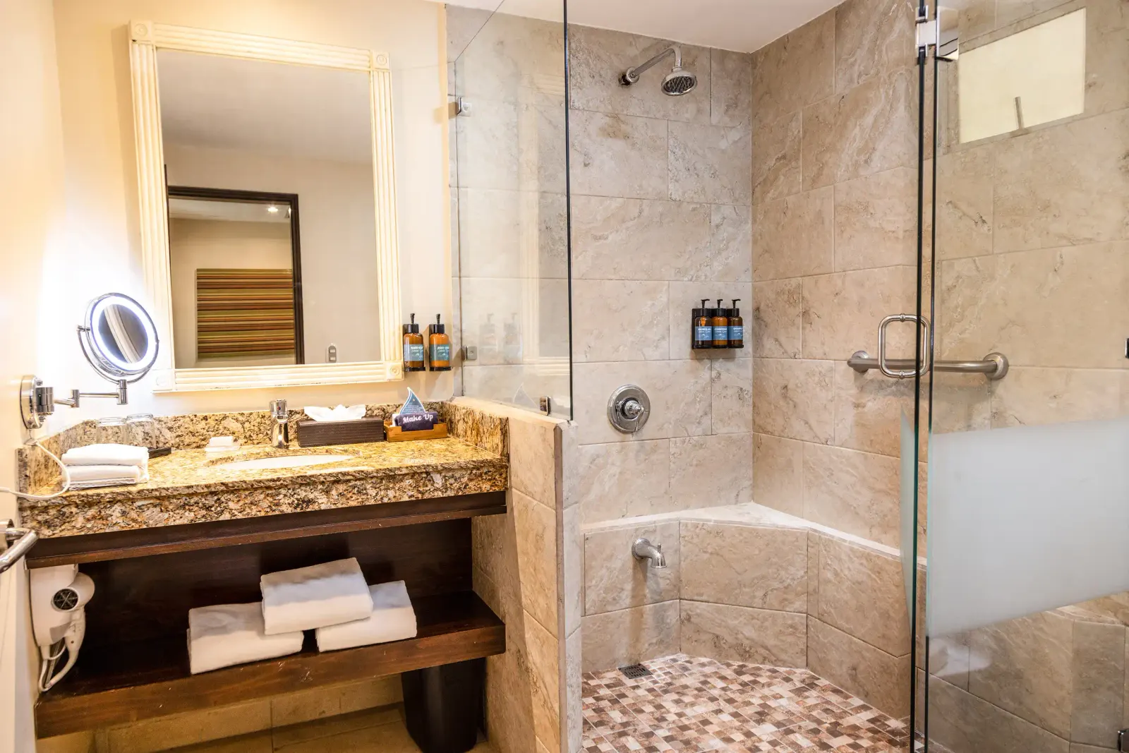 Garden Plus bathroom with a stone vanity and a glass shower