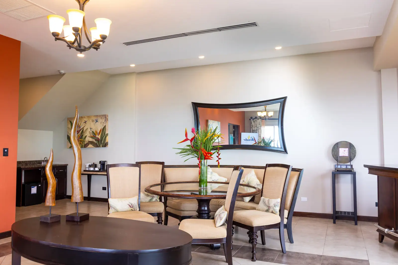 Vista Master Suite dining area with a round table for four under a chandelier