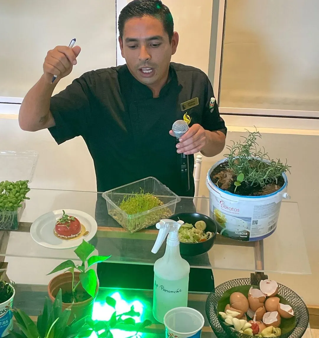 A Parador chef presenting potted herbs, eggshells and a compost demonstration
