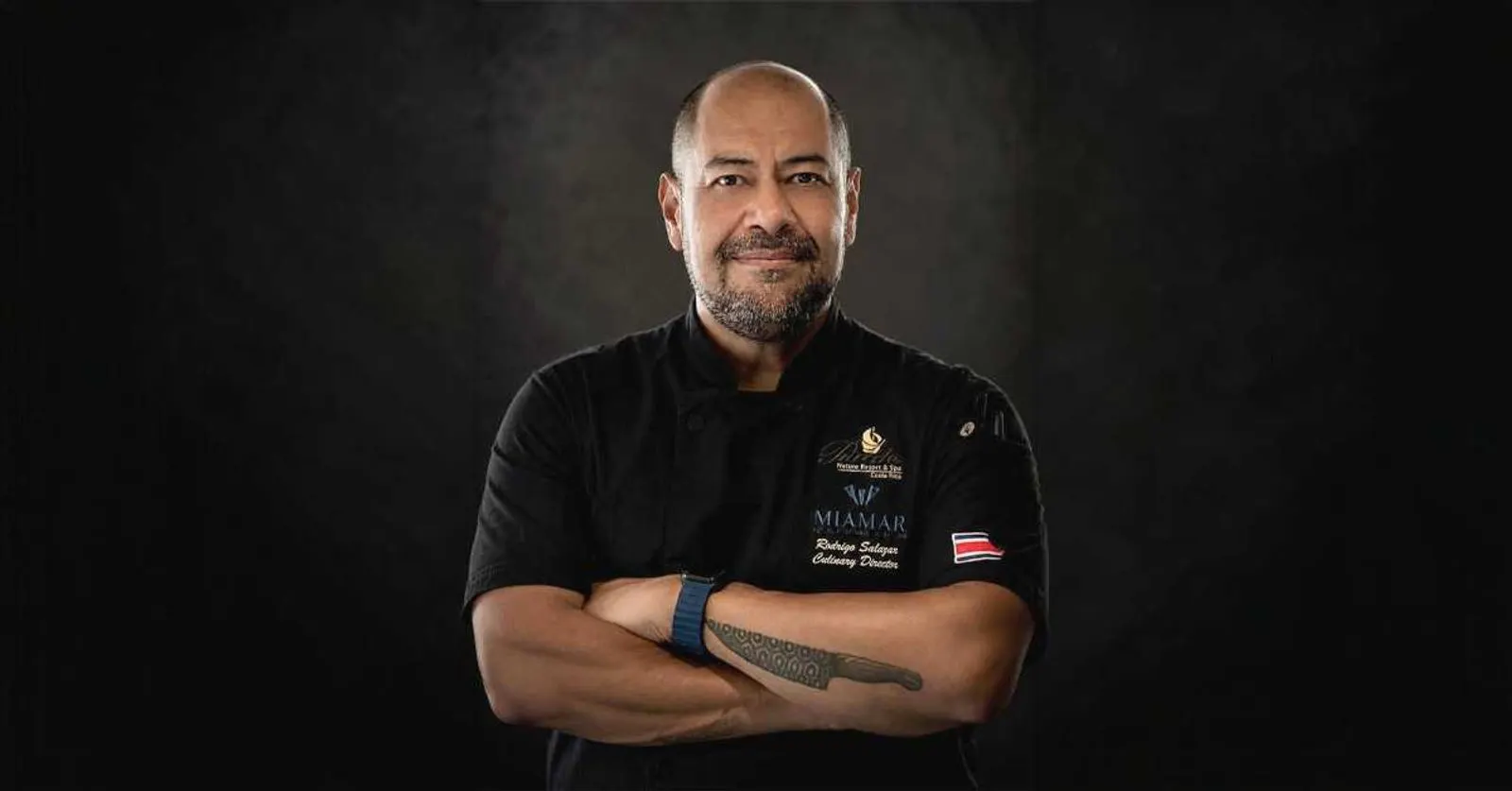 Culinary Director Rodrigo Salazar, arms crossed, in his chef's jacket
