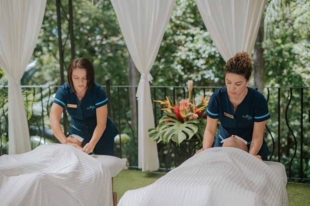 Couples massage in the garden gazebo