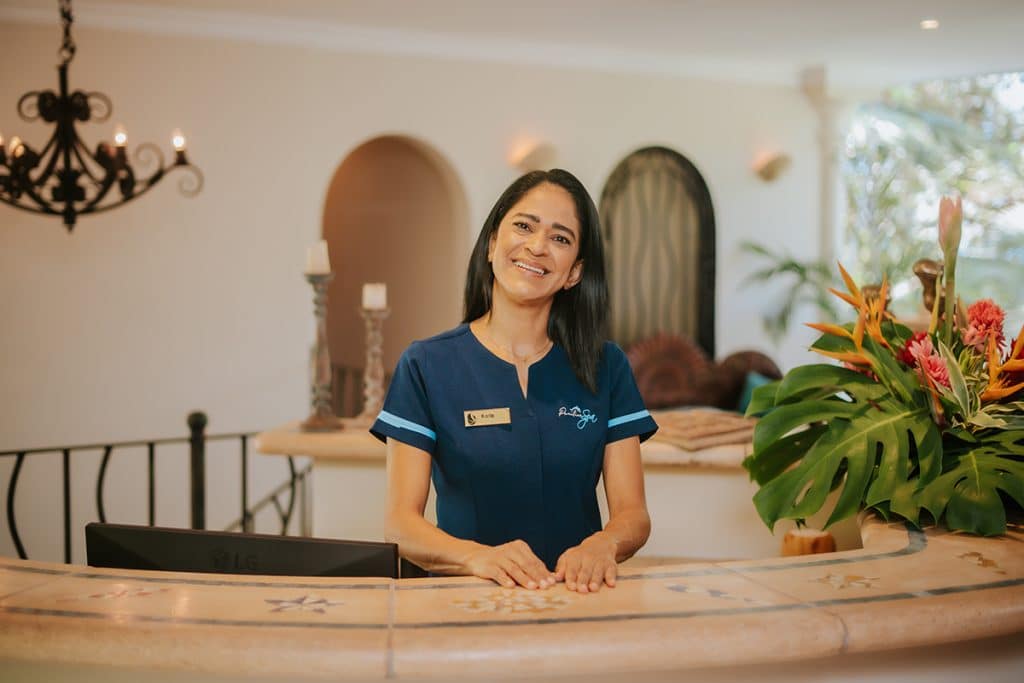 Therapist at the Pacifica Spa reception desk