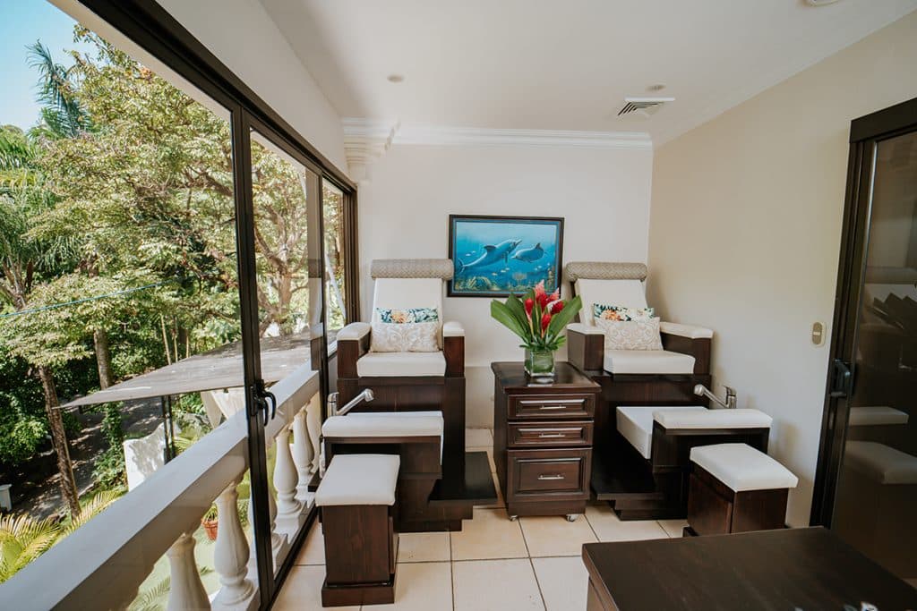 Treatment room with wooden beds and a view of the garden
